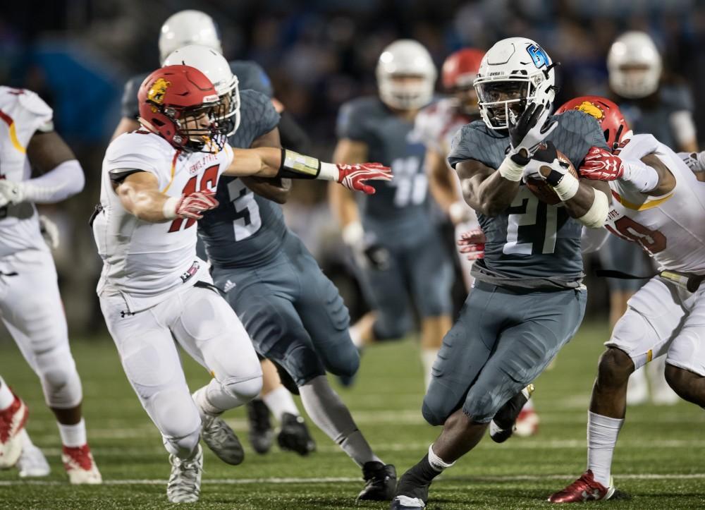 GVL/Kevin Sielaff - Marty Carter (21), under pressure, tip toes his way up the sideline to gain additional yardage. The Lakers defeat the Bulldogs of Ferris State University Saturday, Oct. 8, 2016 with a final score of 35-23 in Allendale. 