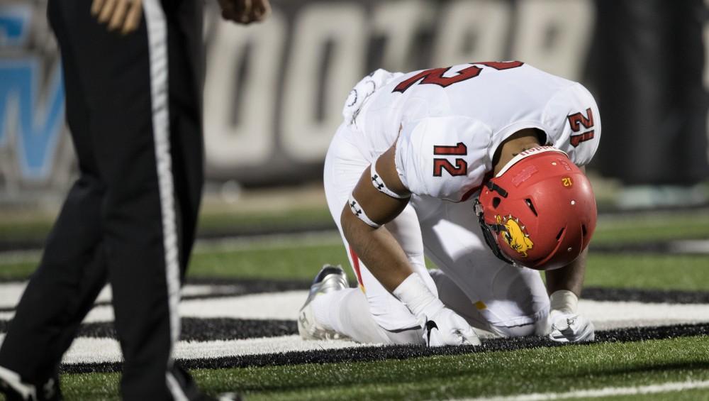 GVL/Kevin Sielaff - Ferris State's Malik Taylor (12) reacts to losing a fumble recovery in their own end zone. The Lakers defeat the Bulldogs of Ferris State University Saturday, Oct. 8, 2016 with a final score of 35-23 in Allendale. 