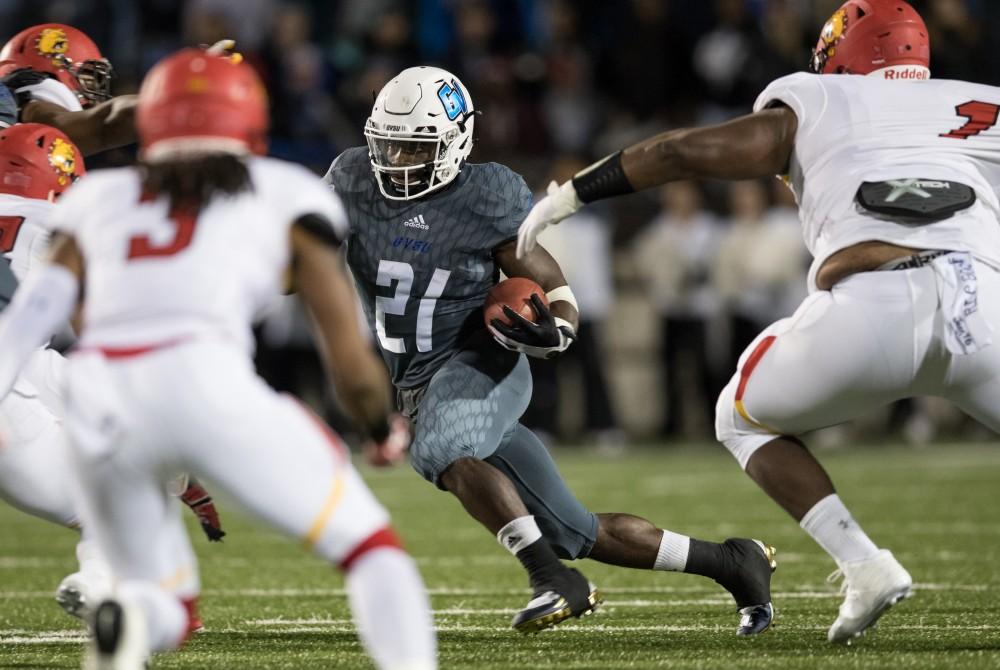 GVL/Kevin Sielaff - Marty Carter (21) races up through the pocket and looks to gain yardage. The Lakers defeat the Bulldogs of Ferris State University Saturday, Oct. 8, 2016 with a final score of 35-23 in Allendale. 