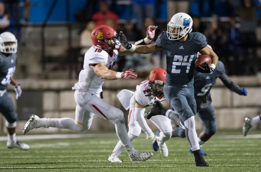 GVL/Kevin Sielaff - Matt Williams (24) stiff arms Ferris' Jordan Haan (18) as he fields a kick-off return. The Lakers defeat the Bulldogs of Ferris State University Saturday, Oct. 8, 2016 with a final score of 35-23 in Allendale. 