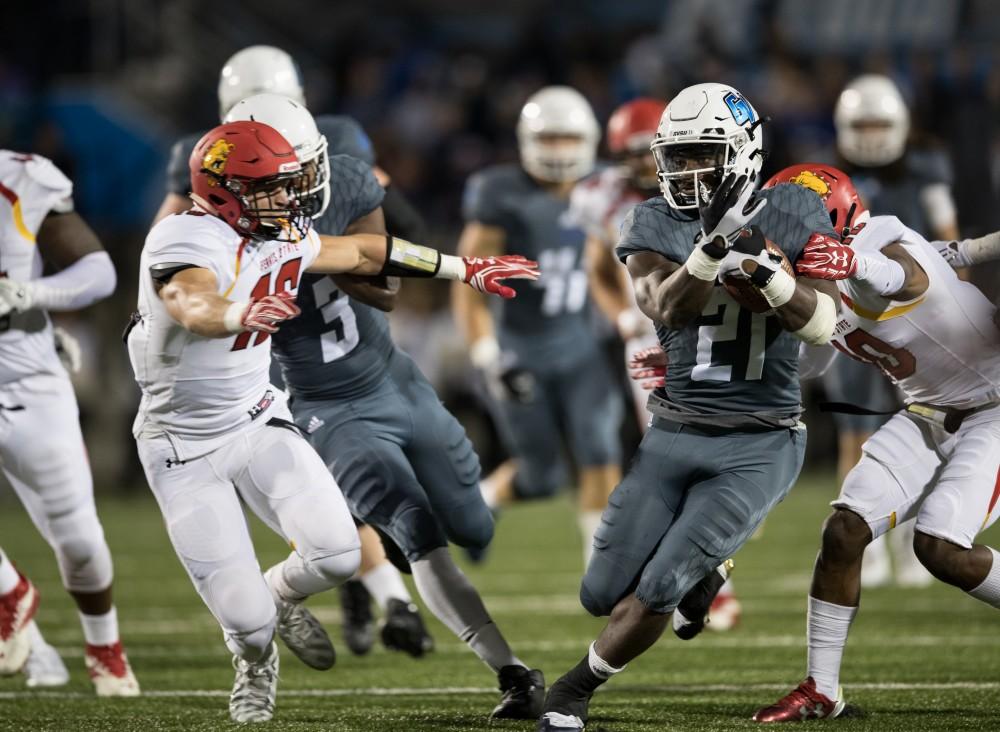 GVL/Kevin Sielaff - Marty Carter (21) rushes the ball up the field. The Lakers square off against the Bulldogs of Ferris State University Saturday, Oct. 8, 2016. 