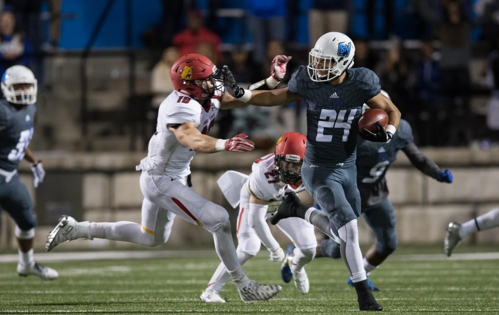 GVL/Kevin Sielaff - Matt Williams (24) stiff arms Jordan Haan (18) of Ferris as he moves up field. The Lakers square off against the Bulldogs of Ferris State University Saturday, Oct. 8, 2016. 