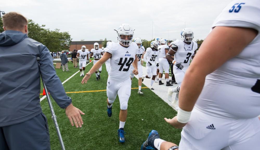 GVL/Kevin Sielaff - Collin Schlosser (49) runs onto the field before the start of the match. The Lakers square off against the Panthers of Ohio Dominican University Saturday, Oct. 1, 2016 and win with a final score of 24-21 in Columbus, OH.