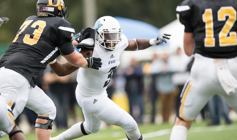 GVL/Kevin Sielaff - Sydney Omameh (3) moves in on the Panthers' quarterback. The Lakers square off against the Panthers of Ohio Dominican University Saturday, Oct. 1, 2016 and win with a final score of 24-21 in Columbus, OH.