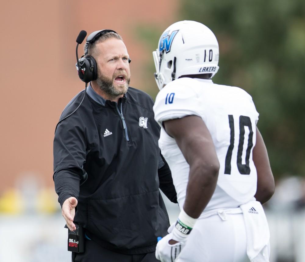 GVL/Kevin Sielaff - Head coach Matt Mitchell high fives Urston Smith (10) as he comes off of the field. The Lakers square off against the Panthers of Ohio Dominican University Saturday, Oct. 1, 2016 and win with a final score of 24-21 in Columbus, OH.