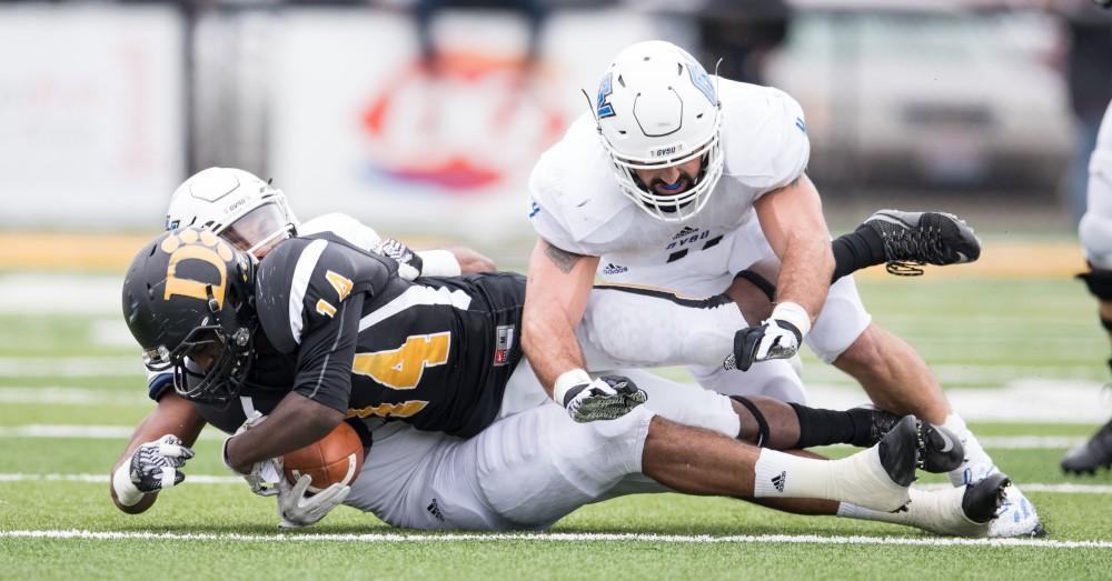 GVL/Kevin Sielaff - Alton Voss (4) brings down E.J. Colson (14) of the Panthers. The Lakers square off against the Panthers of Ohio Dominican University Saturday, Oct. 1, 2016 and win with a final score of 24-21 in Columbus, OH.