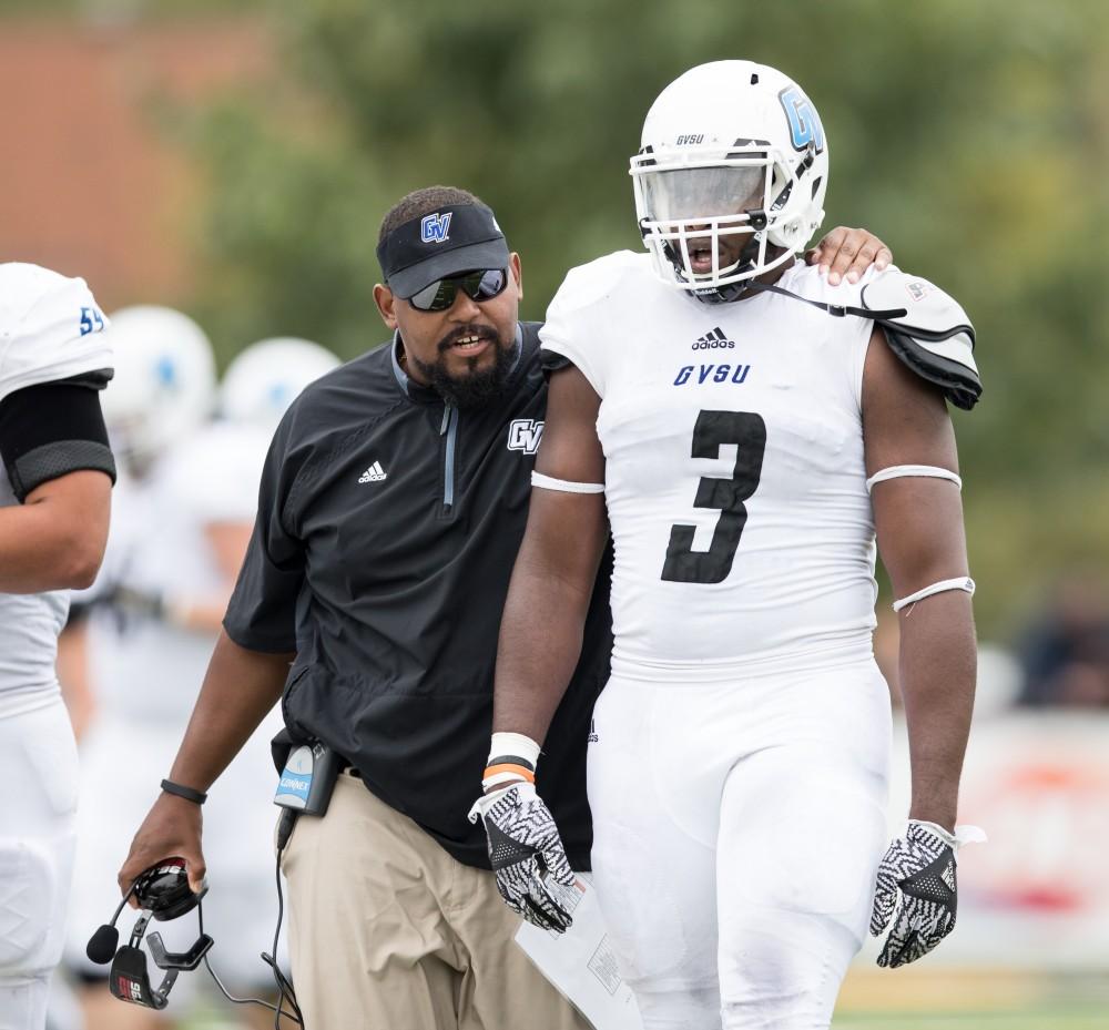 GVL/Kevin Sielaff - E.J. Whitlow speaks with Sydney Omameh (3) as he exits the field. The Lakers square off against the Panthers of Ohio Dominican University Saturday, Oct. 1, 2016 and win with a final score of 24-21 in Columbus, OH.