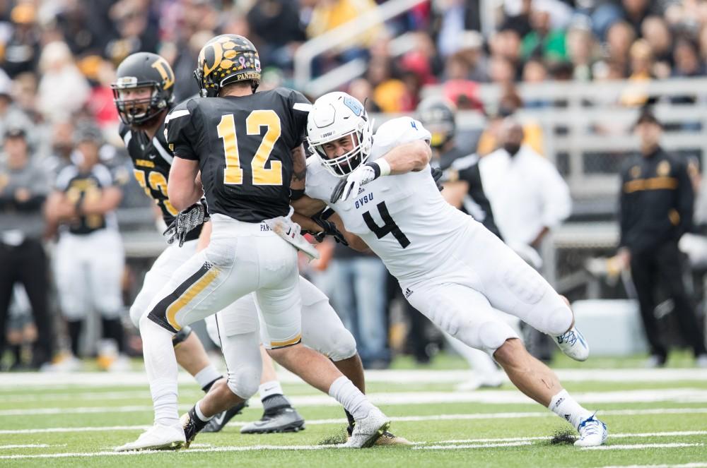 GVL/Kevin Sielaff - Alton Voss (4) moves in on Ohio Dominican's Grant Russell (12) and gets the sack. The Lakers square off against the Panthers of Ohio Dominican University Saturday, Oct. 1, 2016 and win with a final score of 24-21 in Columbus, OH.