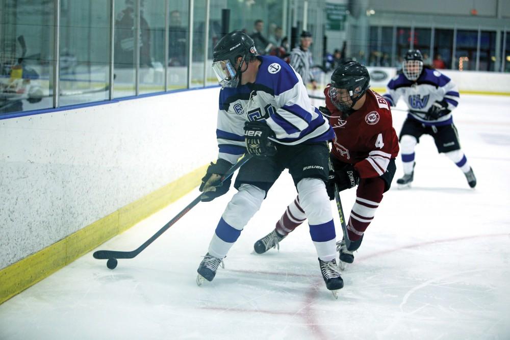 GVL / Emily Frye
Zach Resnick keeps hold of the puck on Friday Oct. 7, 2016 against Rochester College.