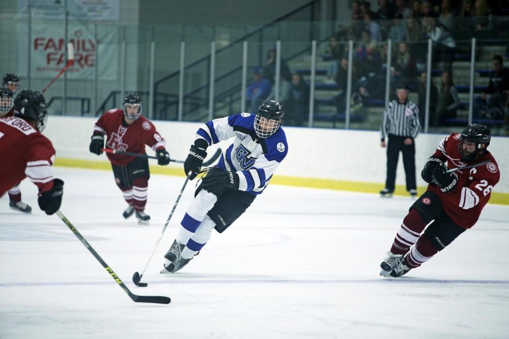 GVL / Emily Frye
Matt Sherman keeps hold of the puck on Friday Oct. 7, 2016 against Rochester College.