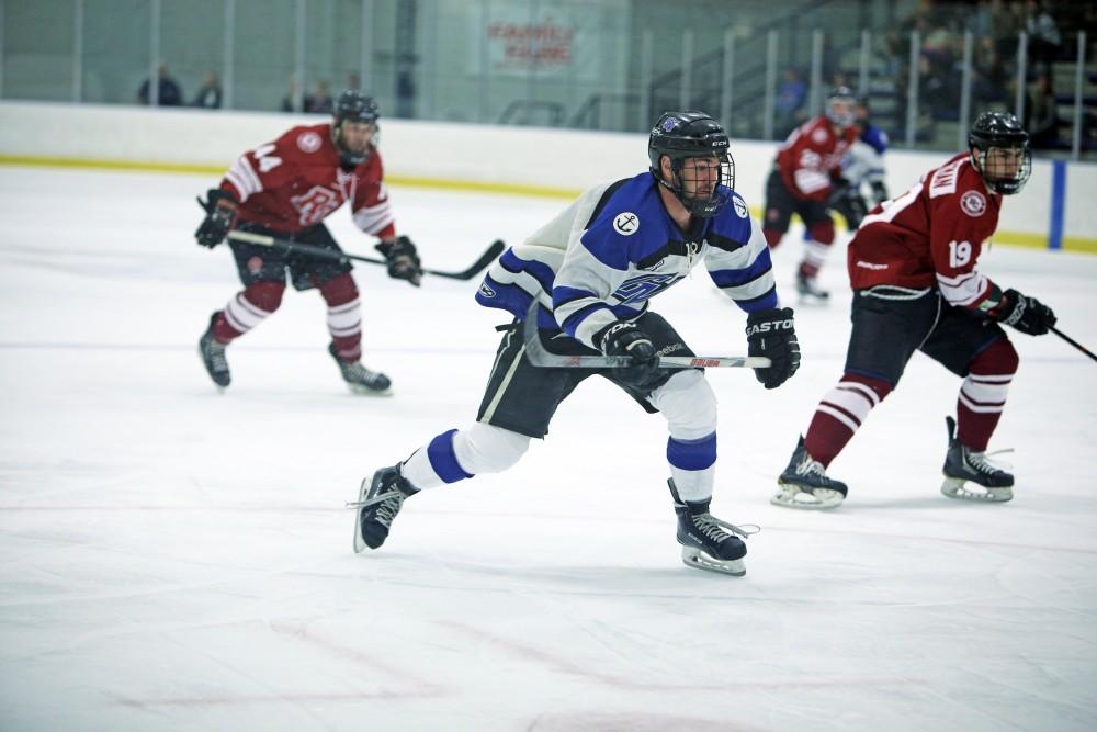 GVL / Emily Frye
Lucus Little races to the puck on Friday Oct. 7, 2016 against Rochester College.