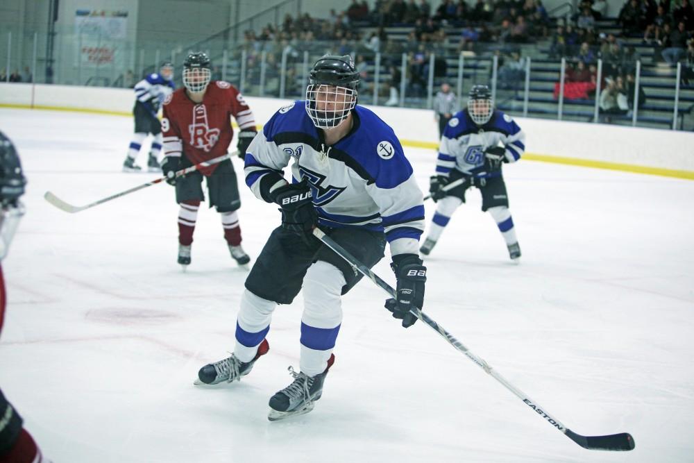 GVL / Emily Frye
Matt Sherman goes for the puck on Friday Oct. 7, 2016 against Rochester College.