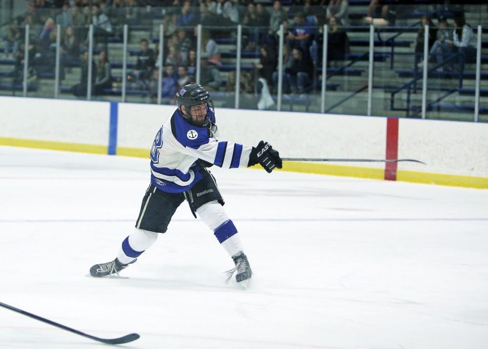 GVL / Emily Frye
Matt Sherman shoots the puck on Friday Oct. 7, 2016 against Rochester College.