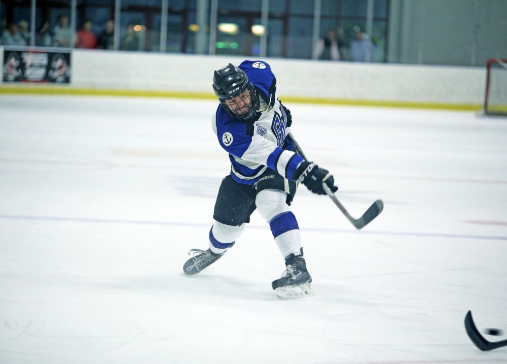 GVL / Emily Frye
Lucus Little shoots the puck on Friday Oct. 7, 2016 against Rochester College.