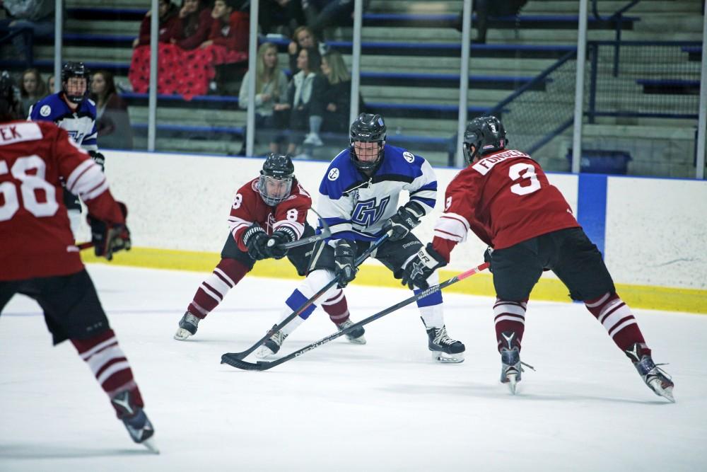 GVL / Emily Frye
Reede Burnett takes the puck down the rink on Friday Oct. 7, 2016 against Rochester College.