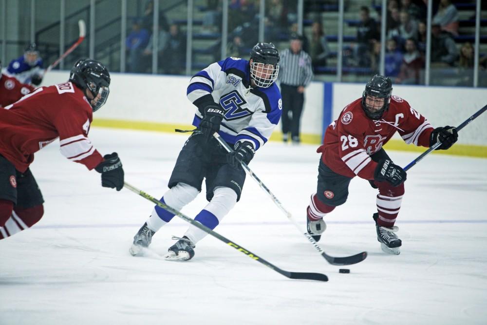 GVL / Emily Frye
Matt Sherman keeps hold of the puck on Friday Oct. 7, 2016 against Rochester College.