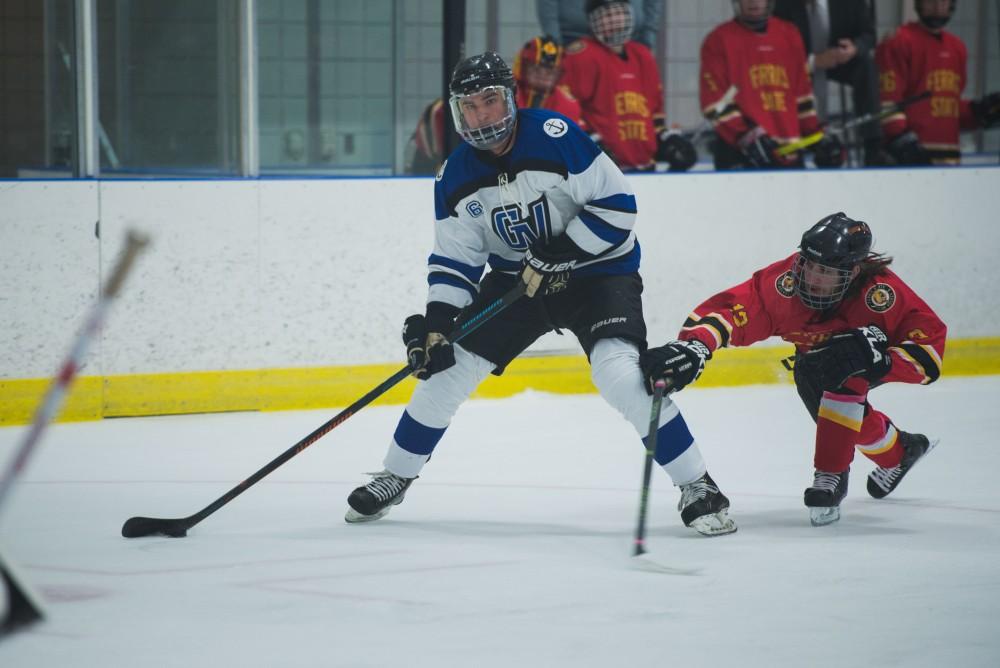 GVL / Luke Holmes - Zach Resnick (6) looks toward the goal to make the play. GVSU Men’s D2 Hockey defeated Ferris State University with a score of 8-1 on Saturday, Oct. 16, 2016.