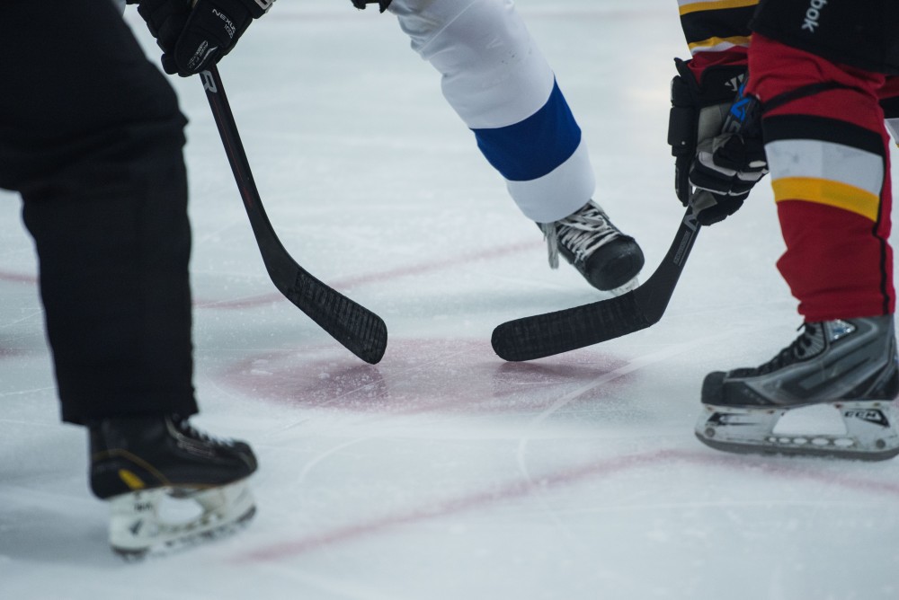 GVL / Luke Holmes - The puck is about to be dropped for the face-off. GVSU Men’s D2 Hockey defeated Ferris State University with a score of 8-1 on Saturday, Oct. 16, 2016.