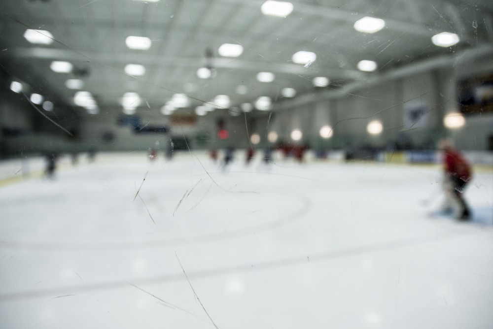 GVL / Luke Holmes - Photographing hockey can become difficult, having to shoot through the scuffed up glass. GVSU Men’s D2 Hockey defeated Ferris State University with a score of 8-1 on Saturday, Oct. 16, 2016.