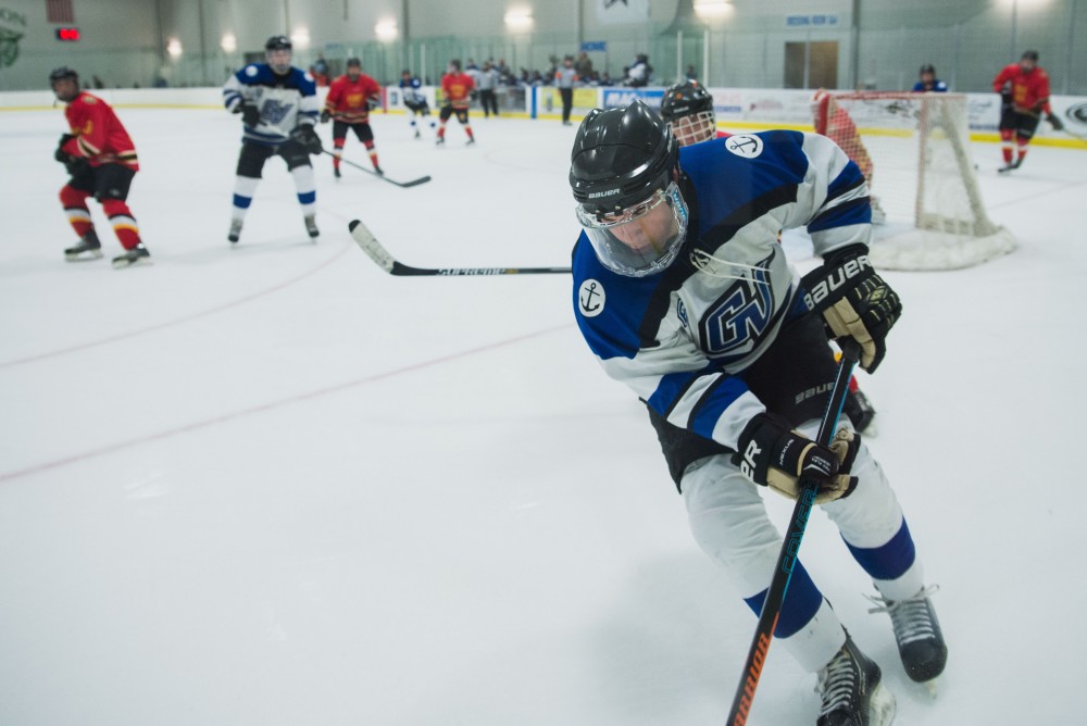 GVL / Luke Holmes - Zach Resnick (6) skates by the boards with the puck. GVSU Men’s D2 Hockey defeated Ferris State University with a score of 8-1 on Saturday, Oct. 16, 2016.