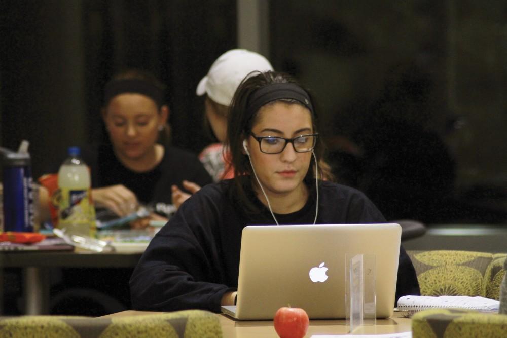 While working on her computer, Oreja Guri, freshman, studies in the Mary Idema Pew Library on Nov. 3 in Allendale, MI. 