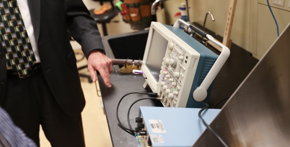 GVL/Kevin Sielaff - Members of the aMDI team Kevin Weaver (right) and Brent Nowak (left) demonstrate an orthoforge device inside of the Cook-DeVos Center for Health Sciences Wednesday, Oct. 26, 2016.  