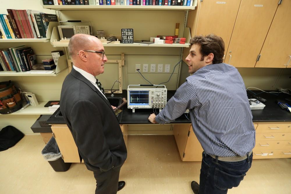 GVL/Kevin Sielaff - Members of the aMDI team Kevin Weaver (right) and Brent Nowak (left) demonstrate an orthoforge device inside of the Cook-DeVos Center for Health Sciences Wednesday, Oct. 26, 2016.  