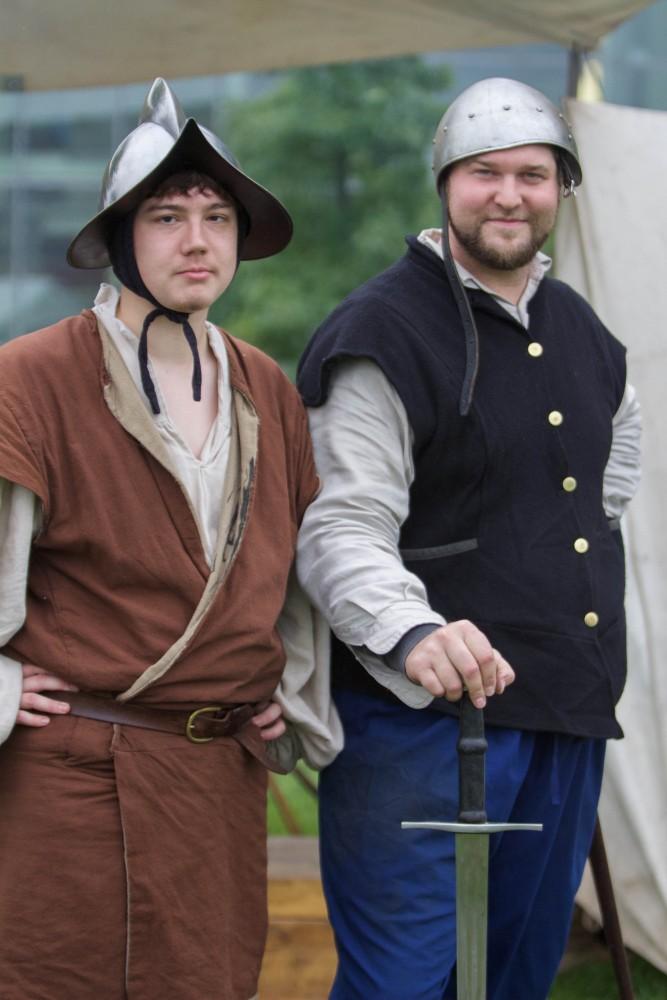 GVL/Mackenzie Bush - Jerry Berg and Andrew Marckini demonstrate war helmets from the 1500s at the Renaissance Fesitval on Saturday, Oct. 1, 2016.
