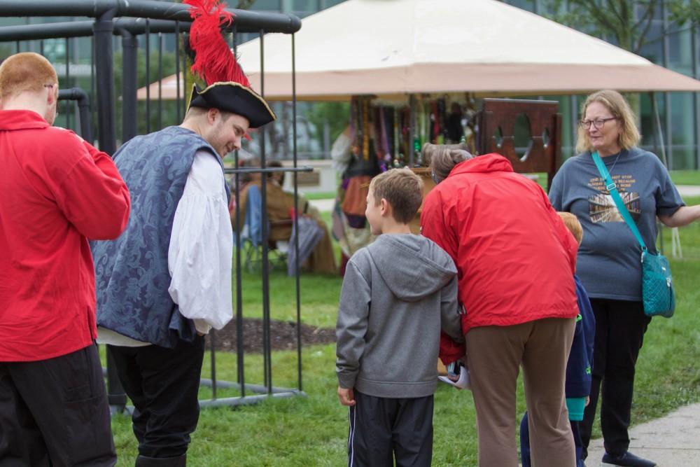 GVL/Mackenzie Bush - A family learns what its like to be jailed in the 1500s at the Renaissance Festival outside Kirkof on Saturday, Oct. 1, 2016.