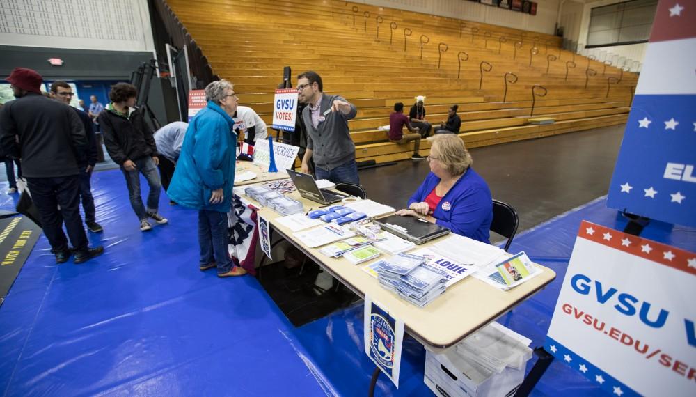 GVL/Kevin Sielaff - Election coordinator Steven Daitch helps with the registration process during Rock the Vote. Student Senate hosts Rock the Vote as part of Student Civic Assembly week Friday, Sept. 30, 2016 inside the Fieldhouse Arena. 