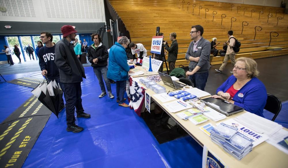 GVL/Kevin Sielaff - Election coordinator Steven Daitch helps with the registration process during Rock the Vote. Student Senate hosts Rock the Vote as part of Student Civic Assembly week Friday, Sept. 30, 2016 inside the Fieldhouse Arena. 