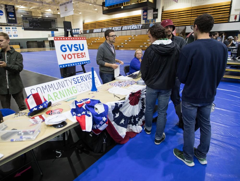 GVL/Kevin Sielaff - Election coordinator Steven Daitch helps with the registration process during Rock the Vote. Student Senate hosts Rock the Vote as part of Student Civic Assembly week Friday, Sept. 30, 2016 inside the Fieldhouse Arena. 