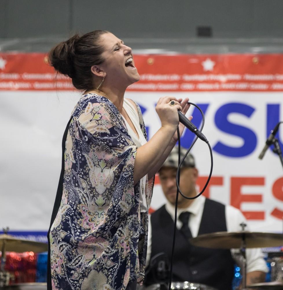 GVL/Kevin Sielaff - Erin Engeseth, lead singer of Love Handle, a Grand Rapids area blues and jazz band, performs on stage during Rock the Vote. Student Senate hosts Rock the Vote as part of Student Civic Assembly week Friday, Sept. 30, 2016 inside the Fieldhouse Arena. 