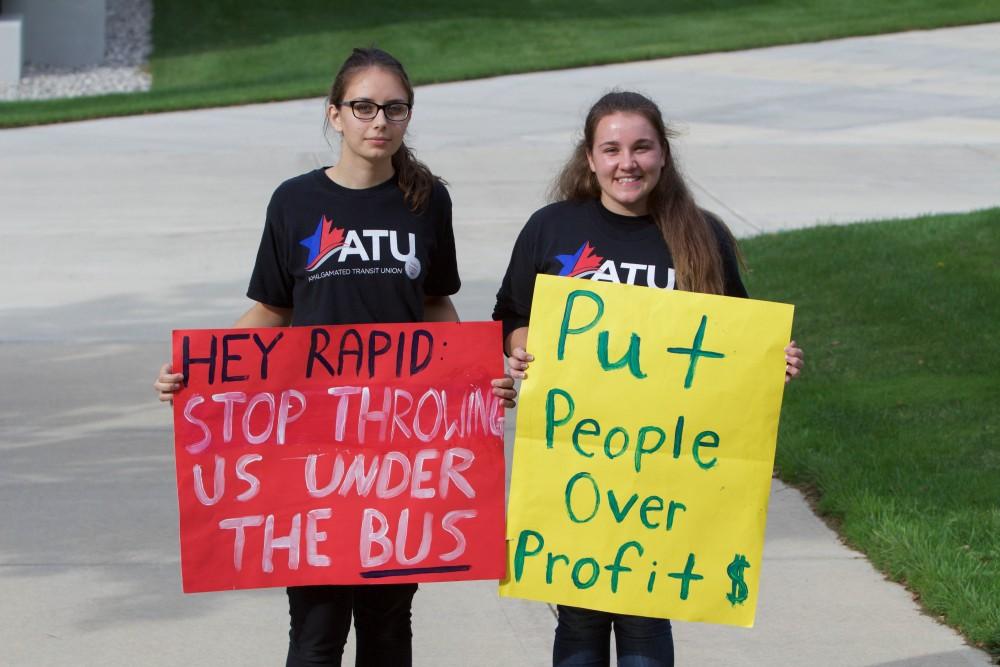 GVL/Mackenzie Bush - Grand Valley students make signs and protest downtown at the United Students Against Sweatshops Midwest Conference on Saturday, Oct. 1, 2016.