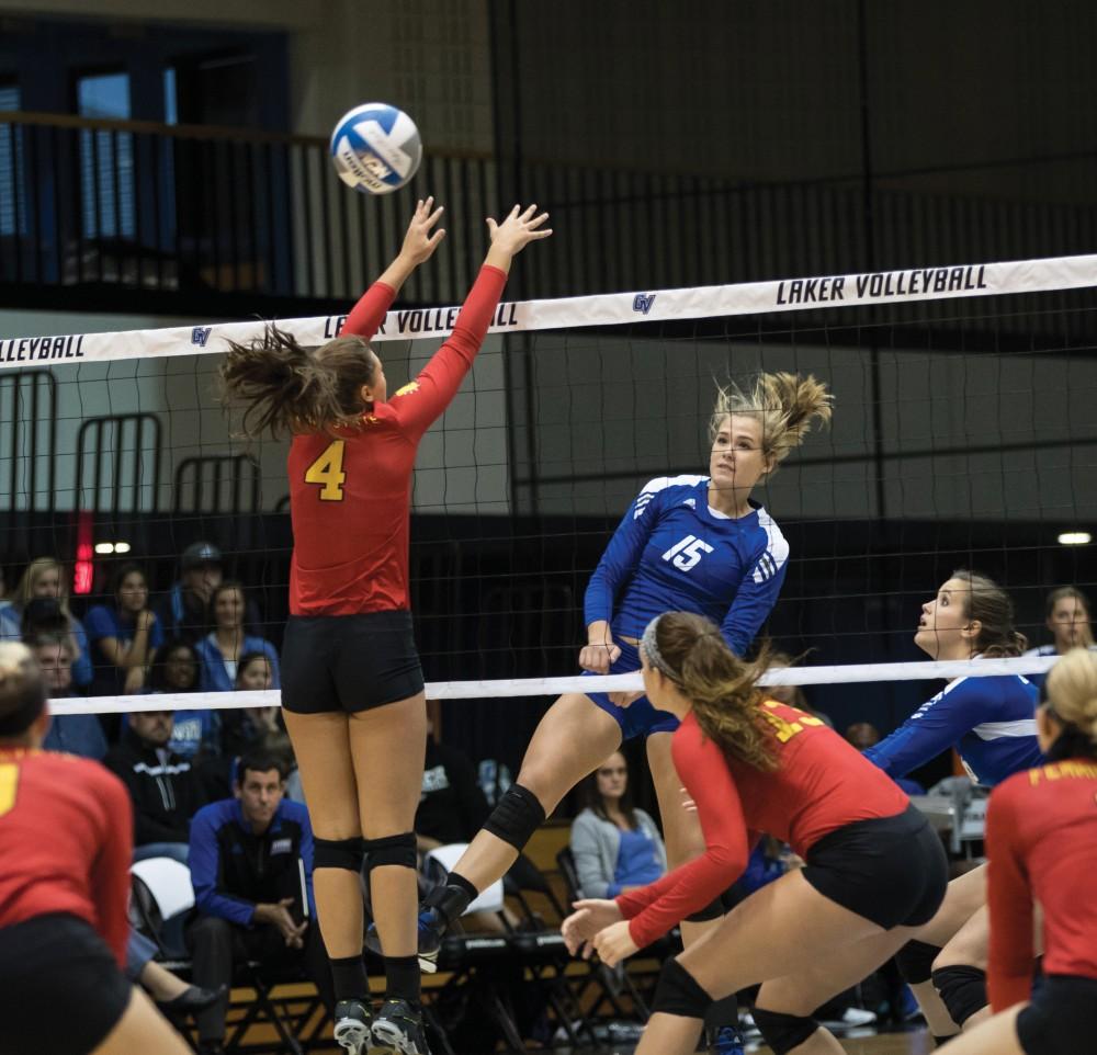 GVL/Kevin Sielaff - Jayci Suseland (15) spikes the volleyball over the net and past a Ferris blocker. The Lakers fall to the Bulldogs of Ferris State with a final score of 1-3 Tuesday, Sept. 27, 2016 in Allendale.