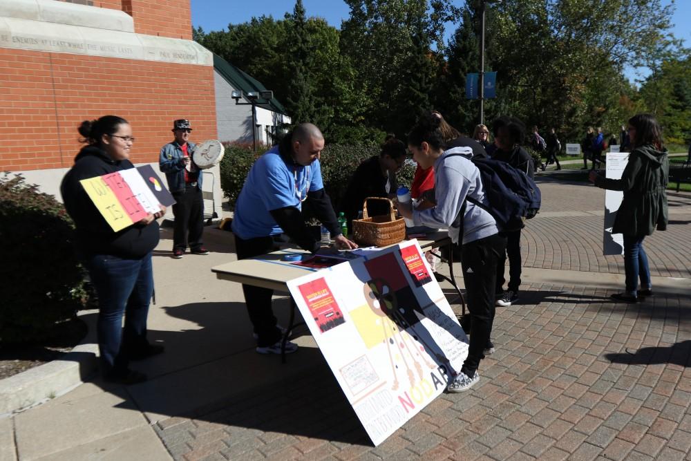 GVL / Luke Holmes - The "Water is Life" awareness rally was held right next to the clock tower on Monday, Oct. 10, 2016.