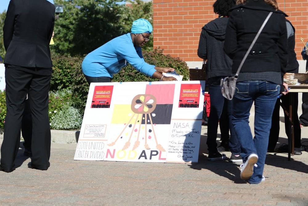 GVL / Luke Holmes - The "Water is Life" awareness rally was held right next to the clock tower on Monday, Oct. 10, 2016.