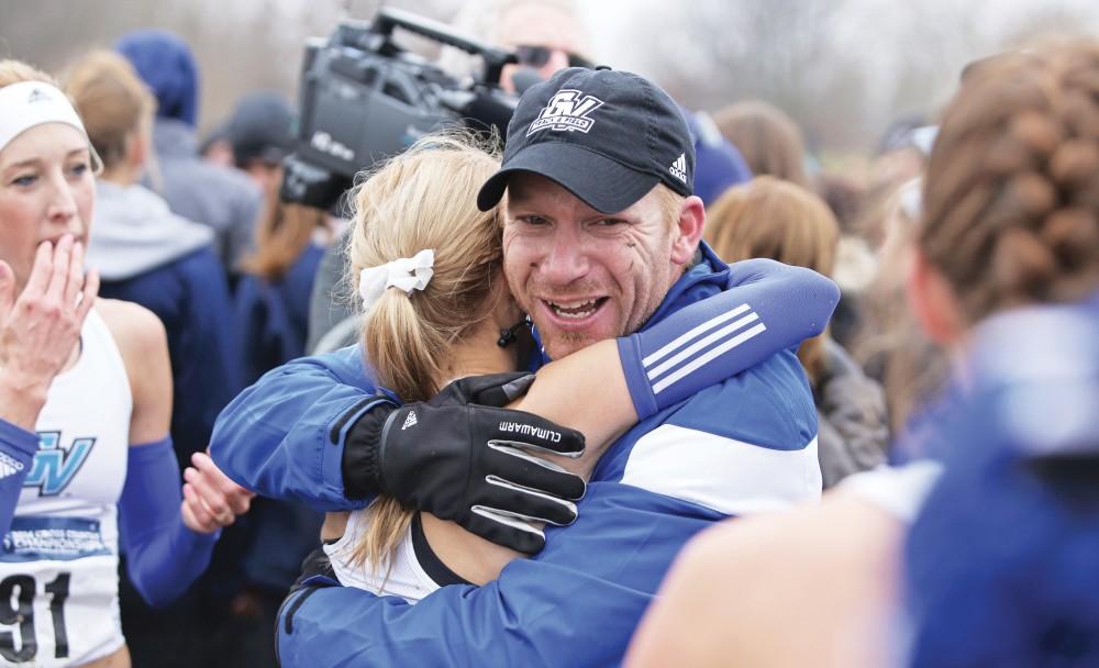 GVL/Kevin Sielaff - Jerry Baltes celebrates a victory with his team during the 2014 Cross Country National Championships in Louisville, KY. 