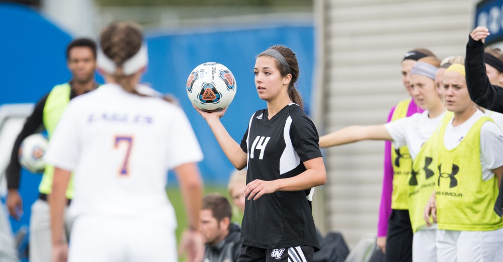 GVL/Kevin Sielaff - Mackenzie Fox (14) throws the ball into play. The Lakers square off against the Eagles of Ashland University Sunday, Oct. 2, 2016 and win with a final score of 5-0 in Allendale.