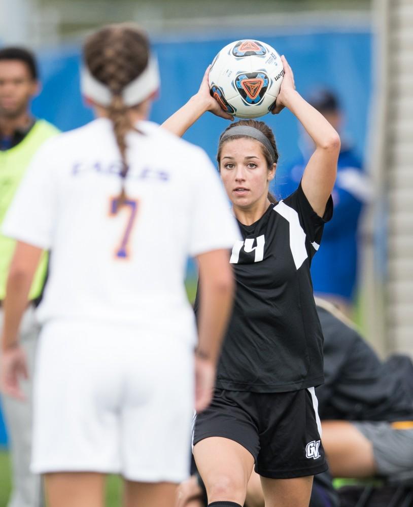 GVL/Kevin Sielaff - Mackenzie Fox (14) throws the ball into play. The Lakers square off against the Eagles of Ashland University Sunday, Oct. 2, 2016 and win with a final score of 5-0 in Allendale.