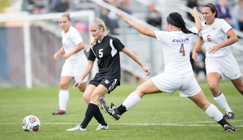 GVL/Kevin Sielaff - Kendra Stauffer (5) moves the ball in front of the Eagles' net and passes it off. The Lakers square off against the Eagles of Ashland University Sunday, Oct. 2, 2016 and win with a final score of 5-0 in Allendale.