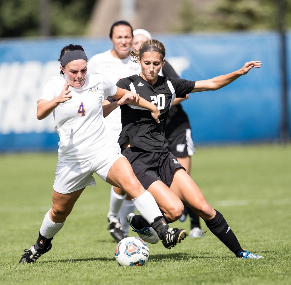 GVL/Kevin Sielaff - Gabriella Mencotti (20) spars with Ashland's Sydney Wright (4). The Lakers square off against the Eagles of Ashland University Sunday, Oct. 2, 2016 and win with a final score of 5-0 in Allendale.