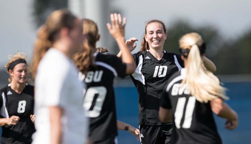 GVL/Kevin Sielaff - Shannon Quinn (10) and company celebrate a goal by Gabriella Mencotti (20). The Lakers square off against the Eagles of Ashland University Sunday, Oct. 2, 2016 and win with a final score of 5-0 in Allendale.