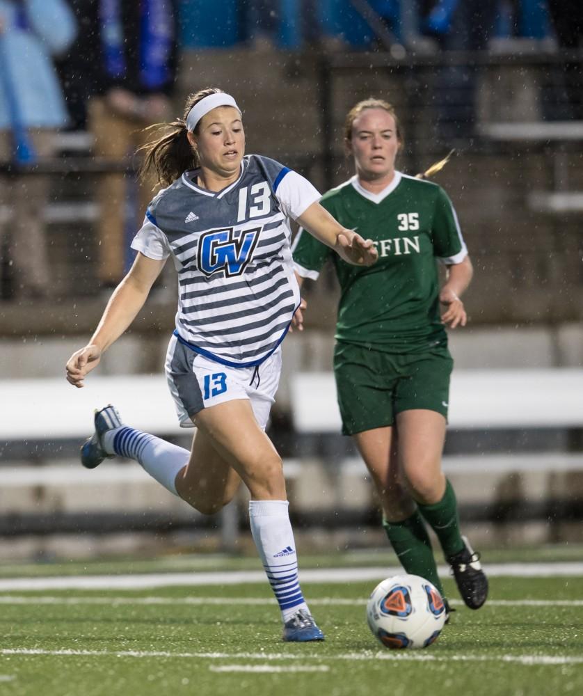 GVL/Kevin Sielaff - Marti Corby (13) crosses the ball in front of Tiffin's net. The Lakers square off against the Dragons of Tiffin University Friday, Sept. 30, 2016 and win with a final score of 10-0 at Lubbers Stadium.