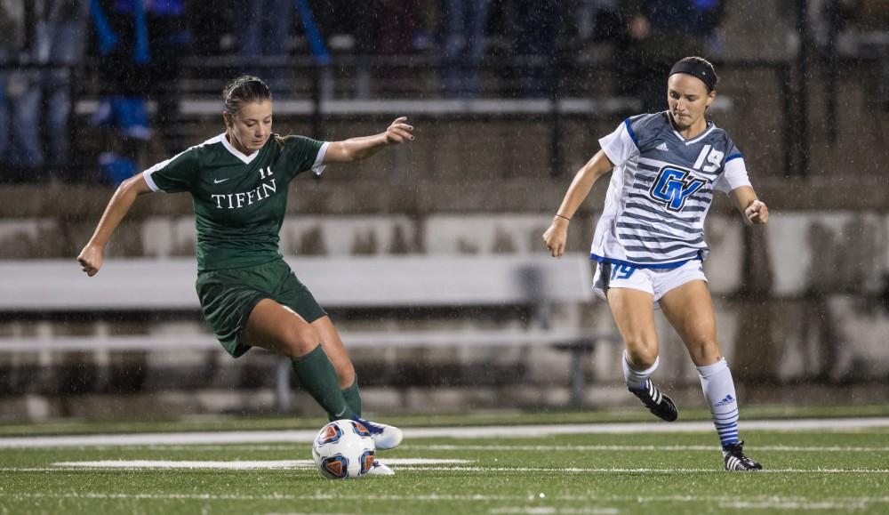 GVL/Kevin Sielaff - Mia Gale (19) fights for the ball at midfield. The Lakers square off against the Dragons of Tiffin University Friday, Sept. 30, 2016 and win with a final score of 10-0 at Lubbers Stadium.