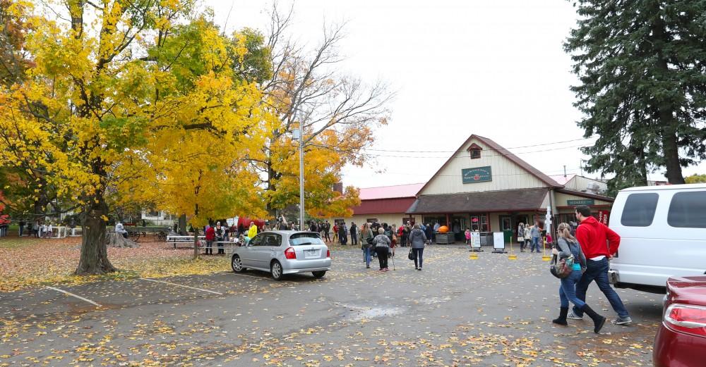 GVL/Kevin Sielaff - Area residents walk about Robinette's Apple Haus & Winery on Sunday, Oct. 30, 2016.  