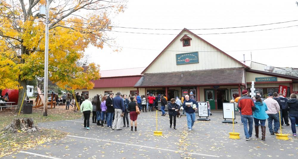 GVL/Kevin Sielaff - Area residents walk about Robinette's Apple Haus & Winery on Sunday, Oct. 30, 2016.  