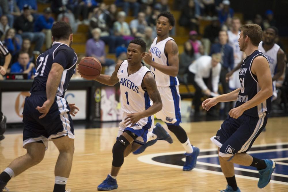 GVL / Luke Holmes - Danzel Wright (1) dribbles the ball down the court. GVSU defeated Trinity Christian on Friday, Nov. 18, 2016. 