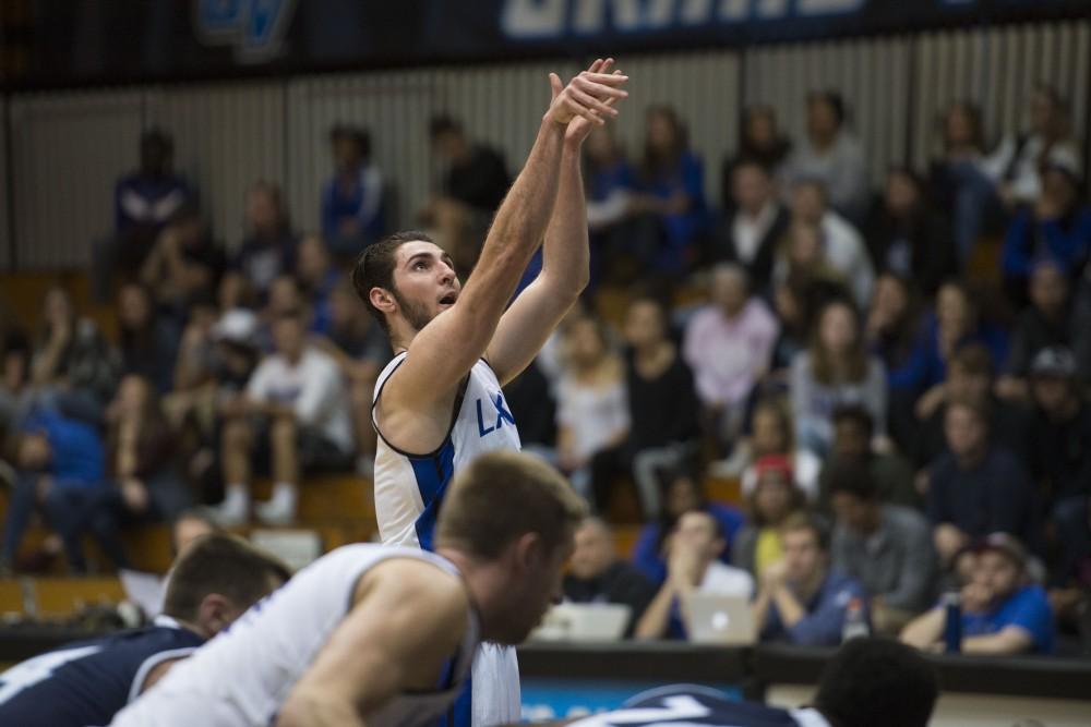 GVL / Luke Holmes - Zach West (11) takes a free throw. GVSU defeated Trinity Christian on Friday, Nov. 18, 2016. 