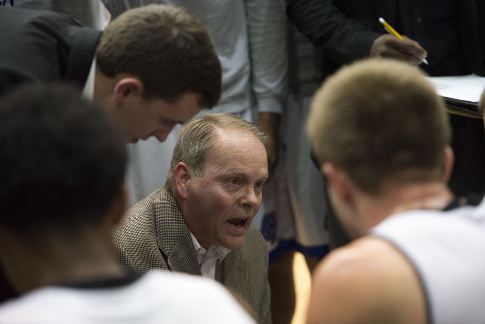 GVL / Luke Holmes - Coach Wesley talks to the players during a timeout. GVSU defeated Trinity Christian on Friday, Nov. 18, 2016. 